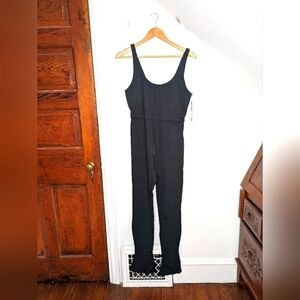 WEWOREWHAT Classic Black Activewear Sleeveless Henley Flare Jumpsuit NEW Size M